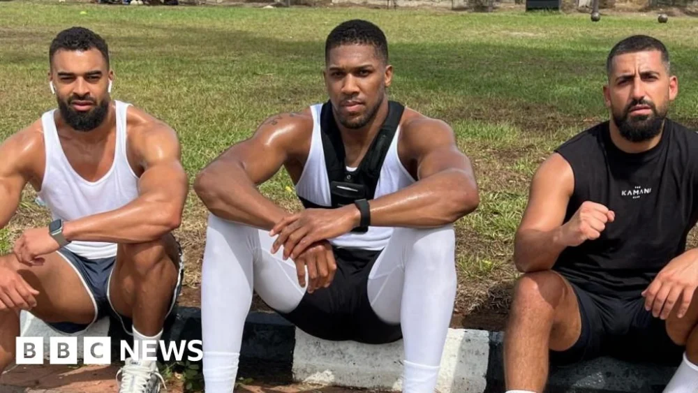 Heavyweight Champion Anthony Joshua Sustains Injuries in Tragic Nigerian Road Collision Claiming Two Lives from His Entourage